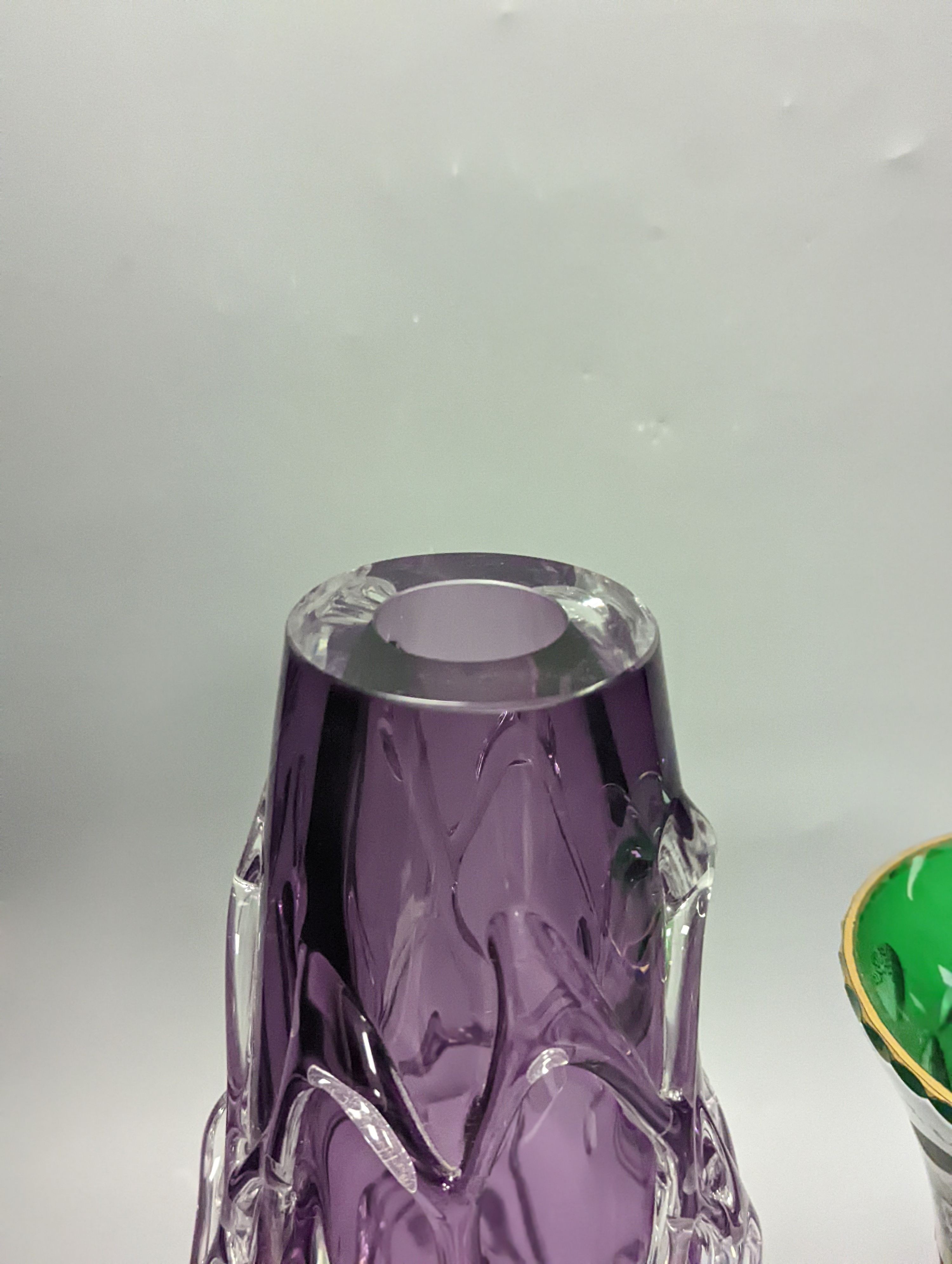 An amethyst art glass vase and Bohemian overlaid green glass vase 34cm